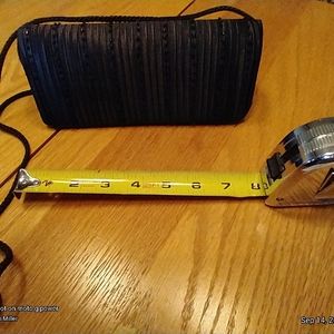 Jessica McClintock satin clutch with cord strap option.